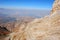 Orange rock on the background of the panorama of mountains of Tien Shan