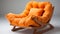 Orange Rocking Chair With Flowing Fabrics: A Futon Chair With Vibrant Color Combinations