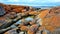 Orange Rocks of the Bay of Fires overlooking the shore Tasmania Australia