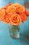 Orange rose flowers in vase