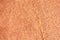 Orange rough stone texture closeup background