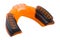 Orange rubber protection of teeth and lips, for boxing or for karate, on a white background