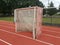 Orange running track with soccer goals