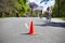 Orange safety cone on the road