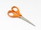 Orange scissor with white background.