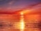 orange Seascape sunset over sea blue sky gold pink yellow sunlight dawn sunbeams reflection on ocean water nature landscape