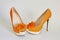 Orange shoe on a high heel