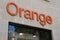 Orange shop brand logo and store text sign facade wall of french agency