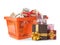 Orange shopping basket with different gifts on background