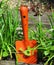 Orange shovel in garden