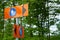 Orange signs showing detour route for pedestrians showing way in two directions.