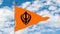 Orange Sikh flag with the image of black Khanda - the main symbol of Sikhism