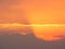 Orange skyscape background with god rays