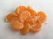 Orange slices of ripe mandarin lying on a white background. Macro shot.