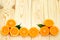 Orange slices on a wooden background. The atmosphere of summer and relaxation. Frame for text from juicy oranges. Bright and juicy