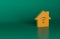 Orange Smart home with wi-fi icon isolated on green background. Remote control. Minimalism concept. 3D render