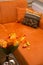 Orange sofa with flower