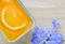Orange soft cake with blue flower