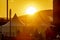 Orange, soft, defocused image of a city tent camp for police officers