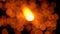 Orange sparkler against dark background, bokeh video. Super slow motion, 500 fps