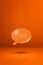 Orange speech bubble on concrete wall vertical background