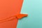 Orange sports whistle on orange background.Concept- sport compet