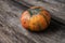 Orange squash pumpkin on rustic wooden boards