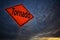 Orange storm road sign of tornado