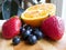 Orange Strawberry Blueberry Fruits on Wooden Cutting Board