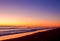 Orange sunrise color on the long beach line