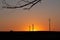 Orange sunset and electric pylons