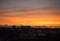 Orange sunset over Bournemouth city silhouette