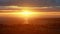 Orange sunset over the sea. Colourful rays of the sun and glare at the moment of sunset or dawn over the city near the