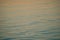 Orange sunset over water surface. Baltic calm sea