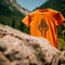 A orange t-shirt with triangle shape logo with a mountain view, created using generative ai tools