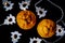 Orange tangerines and a Christmas tree white garland on a black background. Christmas or New Year`s decoration. New Year 2020 is