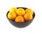 Orange tangerines inside china bowl isolated closeup