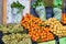 Orange tangerines with leaves and pears  lie on a counter in a fruit store top view. Mandarins in the market