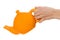 Orange teapot isolated in hand on white background