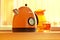 Orange teapot on kitchen table