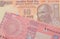 A orange ten rupee bill from India paired with a red ten taka bank note from Bangladesh.