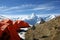 Orange tent in the background of the mountains of Nepal