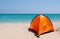 Orange tent on a white beach, camping, tropical, ocean, sand, outdoor life