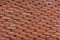 Orange terracotta roof tiles background texture. Roof tiles detail