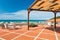 Orange tiled terrace with desk and chairs