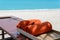 Orange towels in wooden box near beach