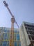 Orange tower crane on a construction site