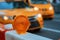 Orange traffic barrier barrels to detour traffic around construction zone shallow depth