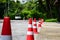 Orange traffic cone are placed to protect the dangers of driving or land traffic