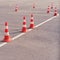 Orange traffic cones on a site in a driving school and parallel parking